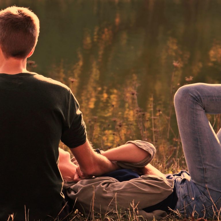 Couple in a calm and intimate moment, expressing emotional connection, presence, and conscious sexuality.
